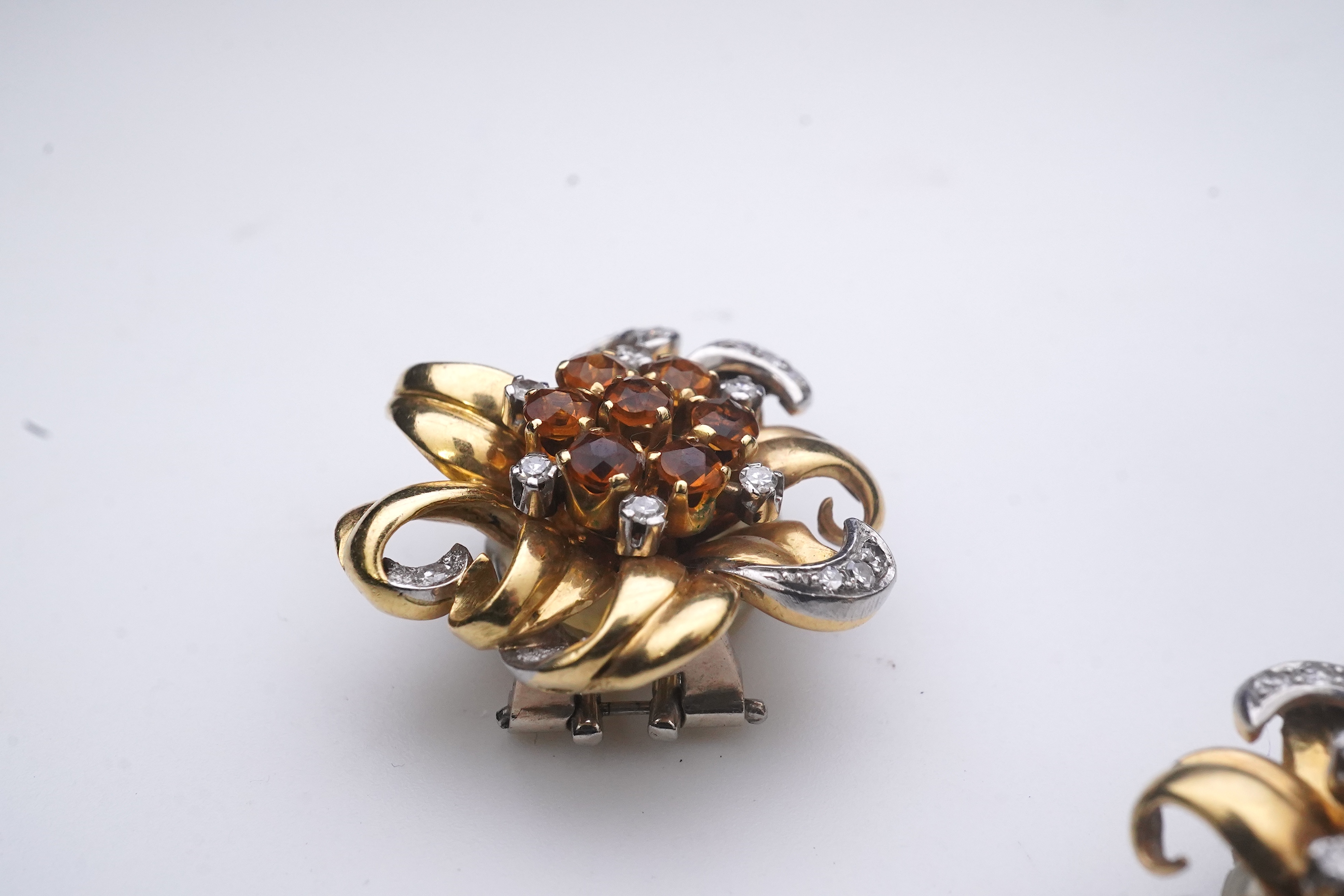 A pair of Retro citrine and diamond ear clips, circa 1940